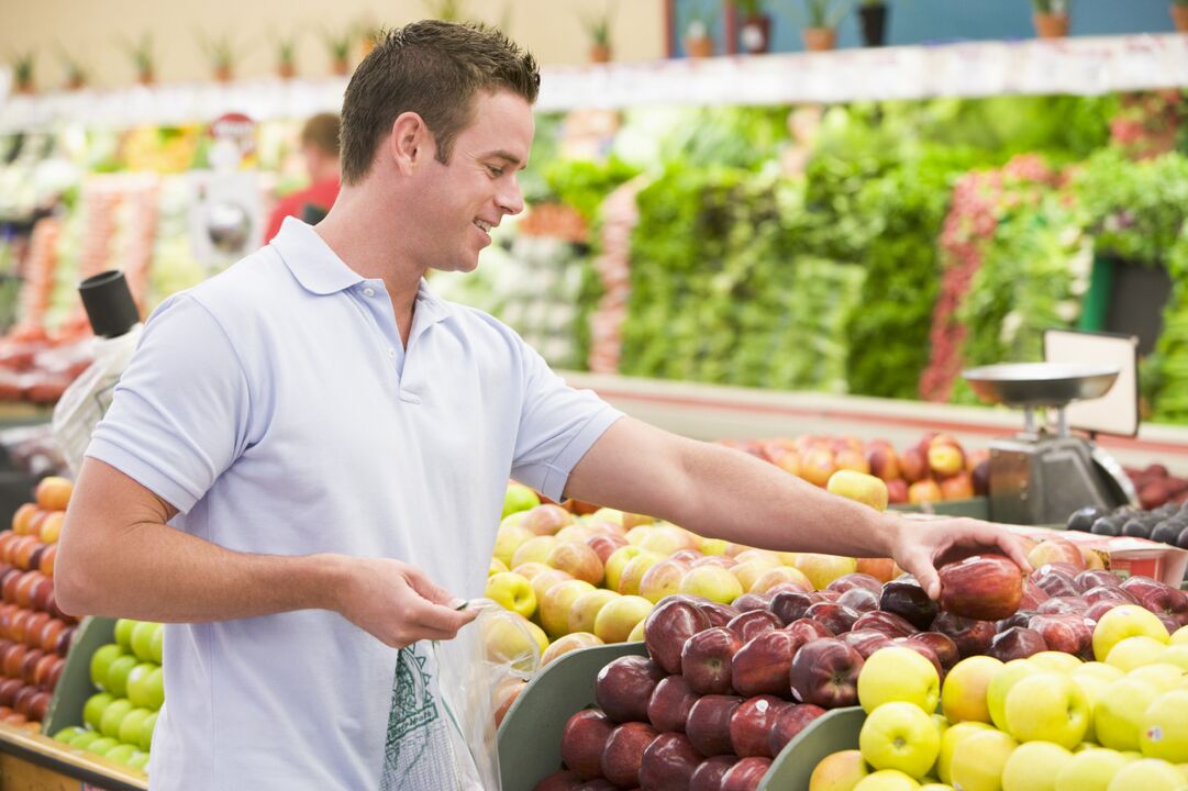 a man chooses fruits to increase potency
